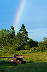 Rainbow by Old Truck in Field in Northern Maine